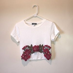 Cream colored crop top with red flowers
